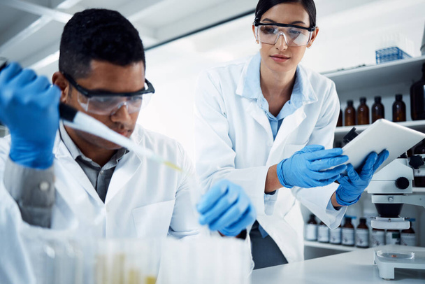People, teamwork or scientists on tablet for test tube results, life extension or antiaging medicine in laboratory. Assistant, vial or biologists with chemistry research, liquid or science update. - Photo, Image