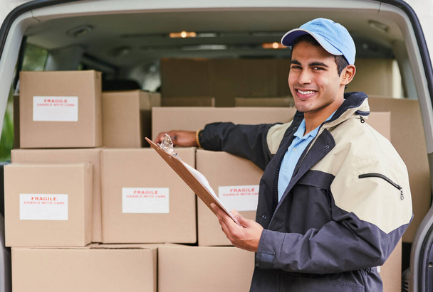 Man, portrait and delivery with van, clipboard and invoice or updates on courier service or quality control. Male dispatcher, checklist and logistics with records or documents for stock inspection - Photo, Image