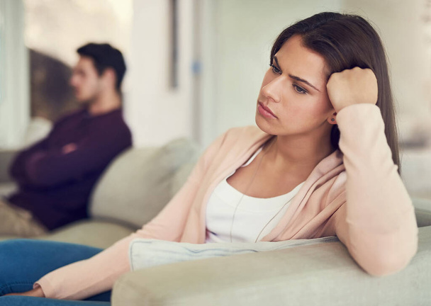 Couple, ignore and angry with argument on sofa in living room with silence, cheating and thinking in home. Woman, man and distance with conflict, fight and divorce with reflection on couch in lounge. - Photo, Image