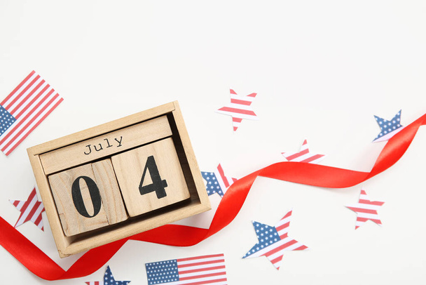 Calendar with date 4 JULY, USA flags and stars on white background. American Independence Day celebration - Photo, Image