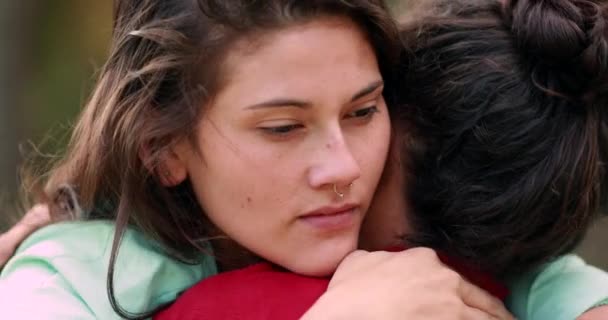Female friends hugging and embracing each other showing support - Filmati, video