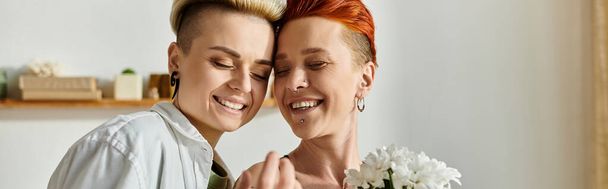Two women with short hair pose in front of a mirror, showcasing their love and style with a confident attitude. - Photo, Image