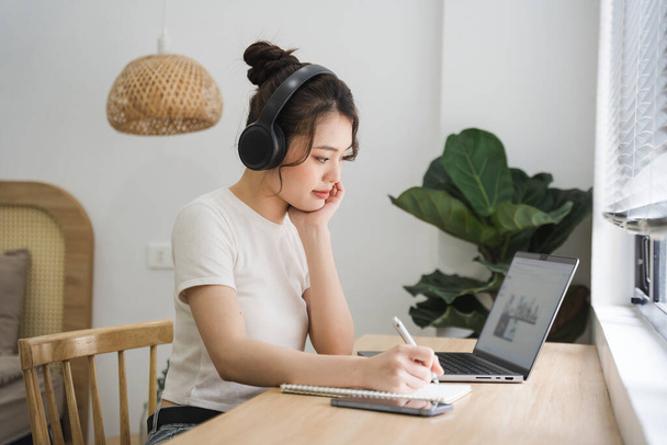 Portrait of asian girl working at home - Photo, Image