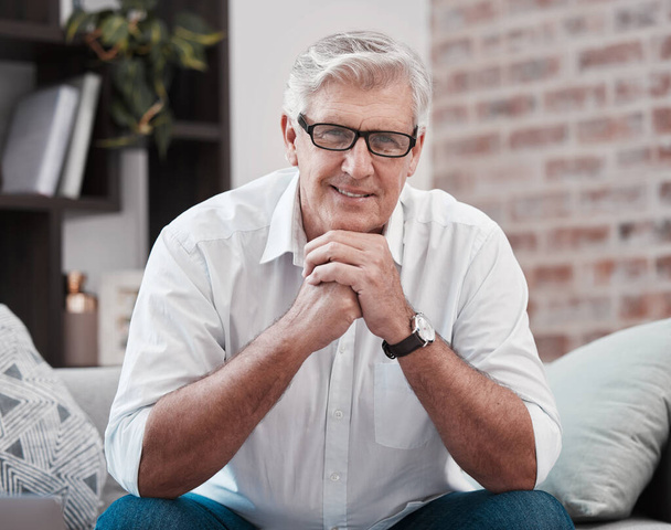 Mature, businessman and portrait on couch with smile for working from home and ceo for startup company. Male person, happy and glasses on sofa for research, reading and pride for stock investment. - Photo, Image