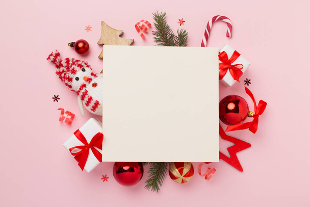 Greeting card mockup with christmas decor on color background, top view - Photo, Image