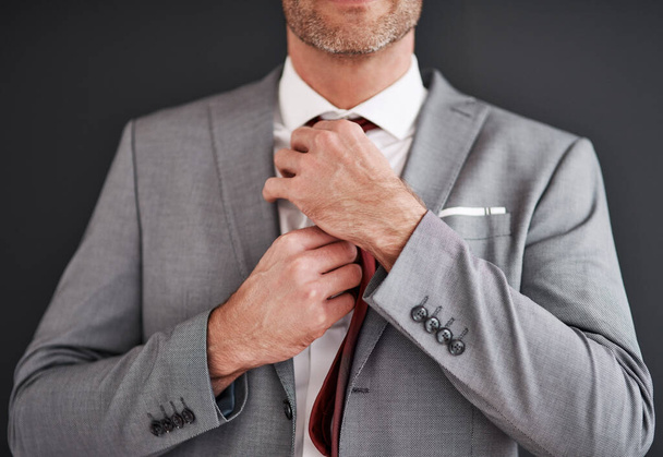 Man, tie and fashion suit in studio, grey background and corporate style. Formal wear, isolated and event attire or broker, success and mature businessman with expensive clothes as professional. - Photo, Image