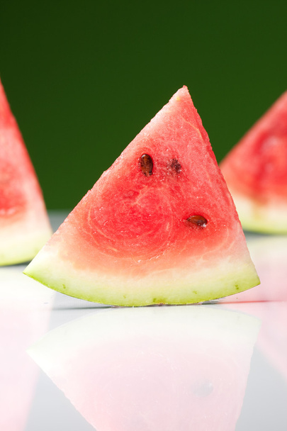 Watermelon slice on green - Photo, image