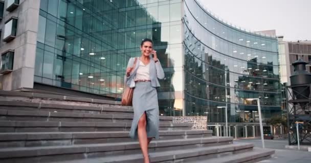 Phone call, business woman and celebration in city for success, winning or goal achievement of excited agent walking. Smartphone, professional and cheers for good news outdoor, promotion or bonus. - Footage, Video