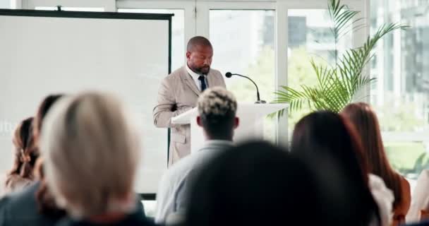 Business man, podium and presentation at seminar, convention and speaking or taking in office. Black male person, speech and explaining company vision to employees, coaching and training crowd. - Footage, Video