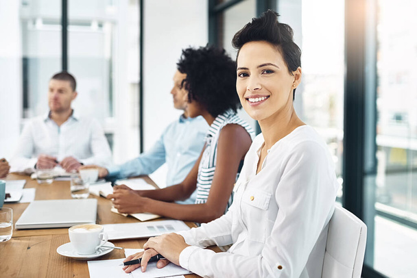 Woman, portrait and business in boardroom with smile, meeting and planning for global sales. Female person, happiness and office with colleagues at table for work, collaboration or teamwork for pitch. - Photo, Image