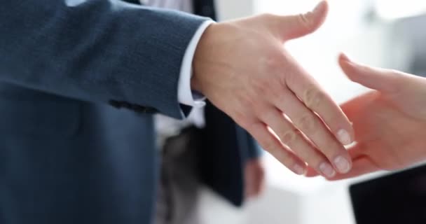 Closeup of business partners shaking hands in office 4k movie slow motion. Successful business deal concept - Footage, Video