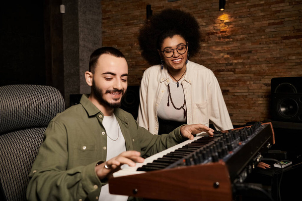 A man and a woman, musicians, collaborating on a music band rehearsal in a professional recording studio. - Foto, Imagem