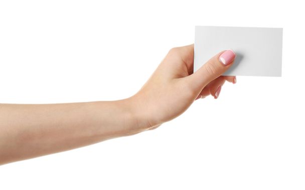 Female hand holding card isolated on white - Foto, afbeelding