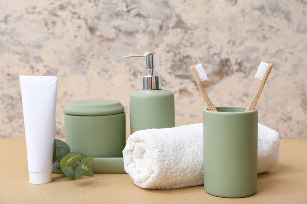 Set of different bath supplies on table against grunge background - Photo, Image