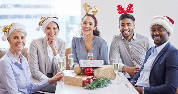 Portrait, Christmas party and business people with celebration, happiness and excited in modern office. Face, staff and employees with diversity, cheerful and Xmas event with joy, group or solidarity. - Photo, Image
