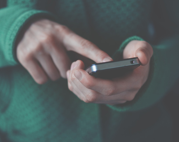 hands using a phone texting on smartphone app - Фото, зображення