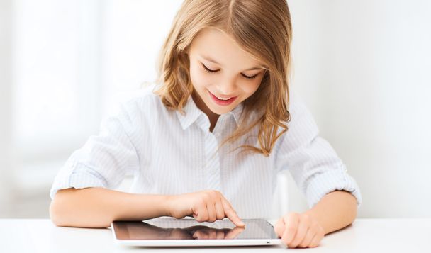 girl with tablet pc at school - Photo, image
