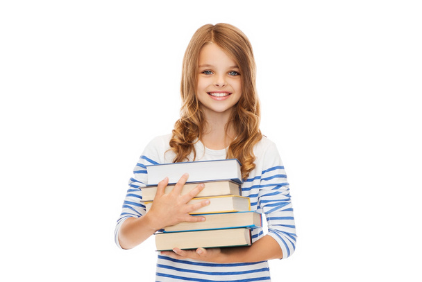 little student girl with many books - Foto, Bild