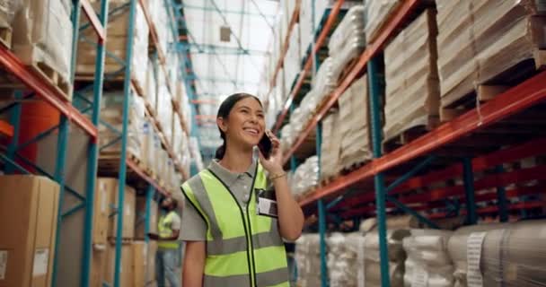 Happy woman, phone call and logistics with storage for conversation, communication or discussion at warehouse. Young female person or employee talking on mobile smartphone for supply chain at depot. - Footage, Video