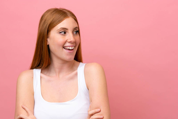 Young redhead woman isolated on pink background - Photo, Image