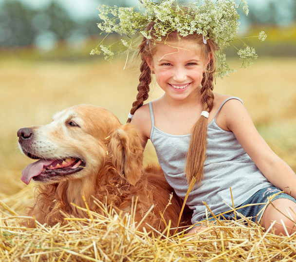 Happy little girl with dog - Фото, зображення