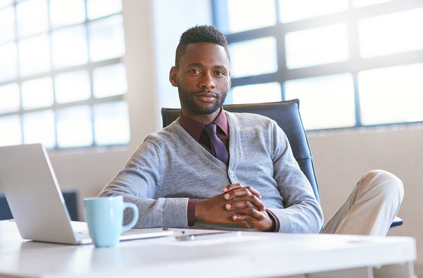 Portrait, black man and laptop on desk in office for creative job as web developer or graphic designer for company. Person, technology and online for website update or software reset for agency. - Photo, Image