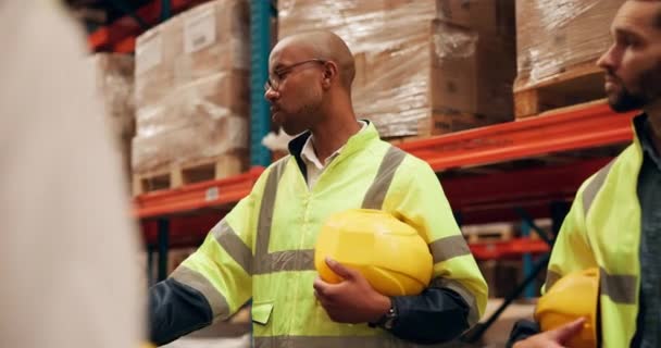 Talking, warehouse and black man in construction at factory with information, feedback and communication for team. Professional, worker and chat about industry planning, process of storage or safety. - Footage, Video