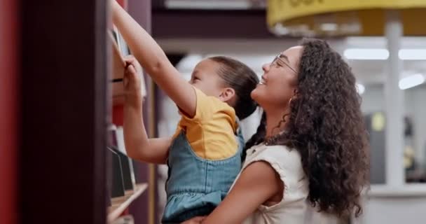Woman, child and library for choice, knowledge and reading for future growth and support. Teacher, kid and smile with help, development and english education for creativity and fantasy storytelling. - Footage, Video