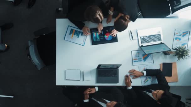 Top down aerial view of professional businesswoman prepare investment data and financial statistic at meeting table while present marketing idea to smart executive manager at whiteboard. Directorate. - Footage, Video