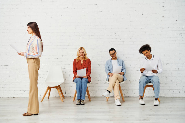 Group of people sitting in a row, waiting for job interview. - Photo, Image