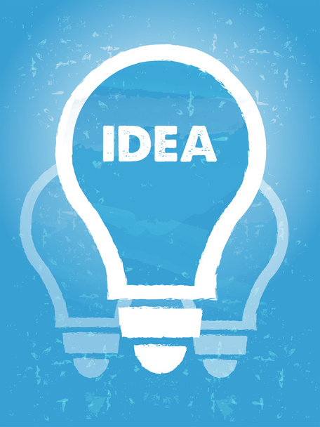 idee in lamp symbool met over blauwe grunge achtergrond - Foto, afbeelding
