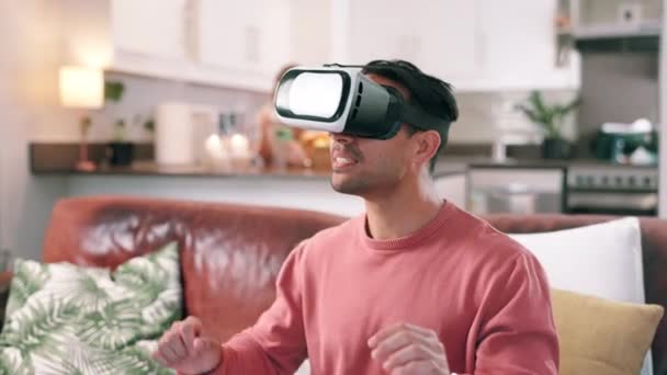 Man, headset and virtual metaverse in home for futuristic technology or gamer streaming, living room or interactive. Male person, hands and esports simulation for user entertainment, online or lounge. - Footage, Video