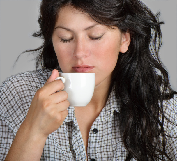 Young woman drinking coffee - Photo, image