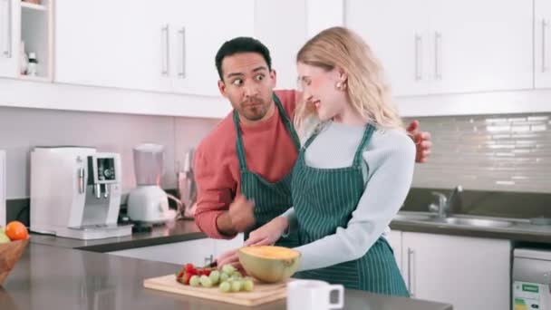Couple, happiness and kitchen in morning with fruit for salad or breakfast, nutrition and wellness with love. Man, woman and together in home for healthy diet with commitment and bonding with food. - Footage, Video