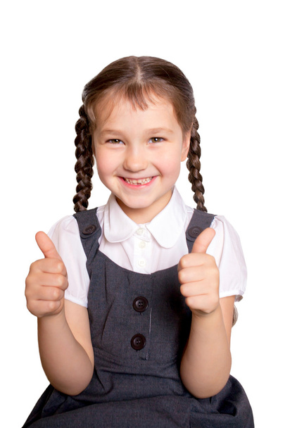 κορίτσι στο σχολείο στολές προβολή αντίχειρες επάνω - Φωτογραφία, εικόνα
