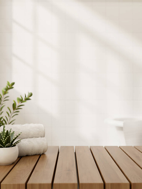 Un'immagine ravvicinata di uno spazio per mostrare i prodotti su un tavolo in legno presenta asciugamani e una pianta in vaso contro la parete bianca in un bagno minimalista. Rendering 3d, illustrazione 3d - Foto, immagini