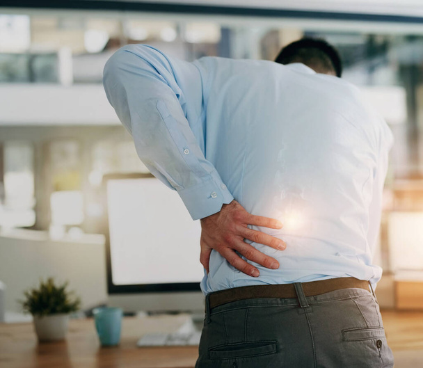 Back pain, business man and anxiety at a corporate company with strain from burnout at law firm. Spine problem, attorney stress and hurt from desk job and joint inflammation from posture at computer. - Photo, Image