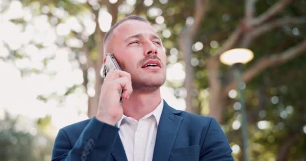 Business, phone call and man with conversation, outdoor and communication with digital app and sunshine. Person, New York city and employee with smartphone and contact with internet and speaking. - Footage, Video