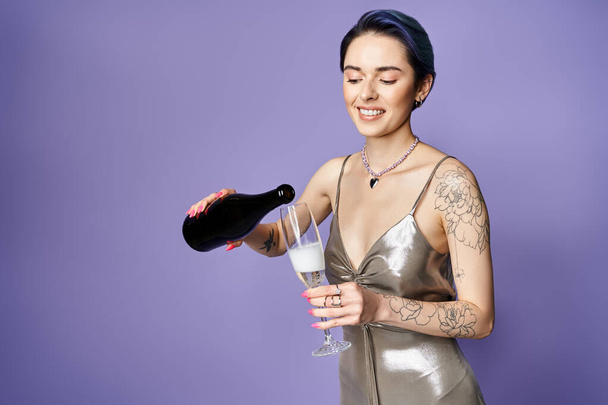 Young woman with short blue hair elegantly poses in a silver dress, holding a champagne glass. - Foto, Bild