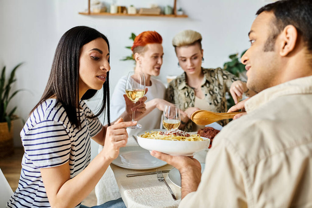 Diverse friends enjoying a meal together with wine. - Photo, Image
