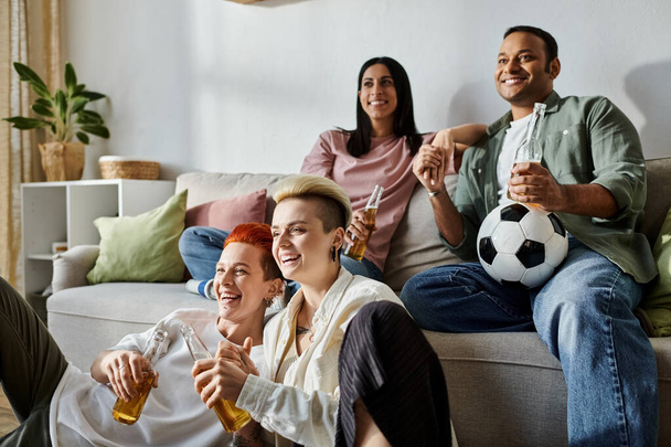 Diverse friends, including a loving lesbian couple, enjoying each others company on a cozy couch. - Photo, Image