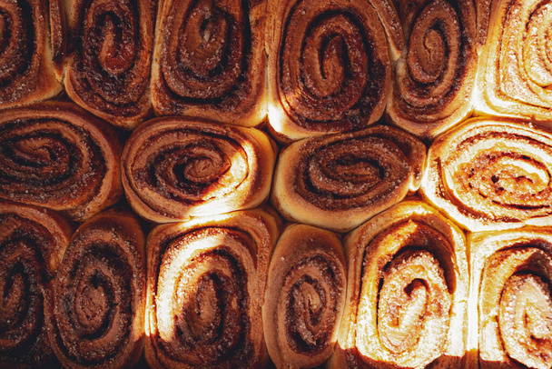 Cinnamon bun roll in plate. Homemade Oven bakery desert for breakfast. High quality photo - Photo, Image