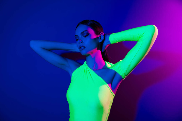 Portrait of pretty nice model girl hands touch head feel comfortable isolated on pink blue color neon background. - 写真・画像