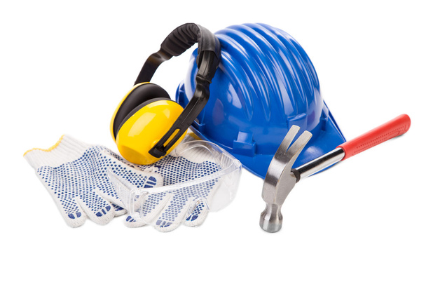 Hard hat, gloves, ear muffs and hammer. - Photo, Image