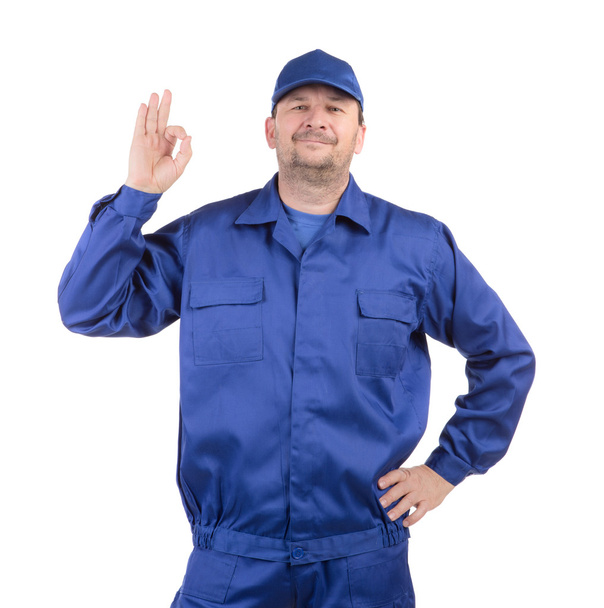 Worker with raised hand. - 写真・画像
