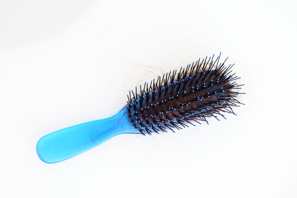 Escova azul aérea com cabelo
 - Foto, Imagem