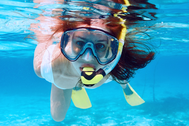 Woman with mask snorkeling - 写真・画像