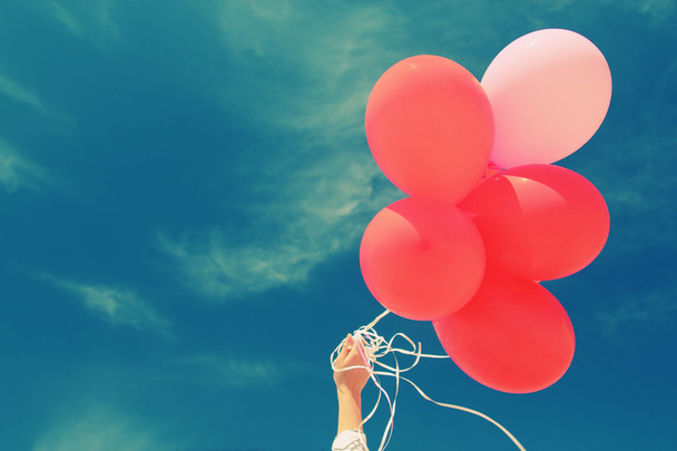 Hand holding red balloons - Photo, Image