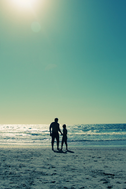 Father and son walking on the beach - Foto, Bild