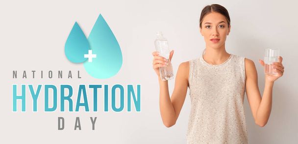 Woman with bottle and glass of water on light background. Banner for National Hydration Day - Фото, зображення